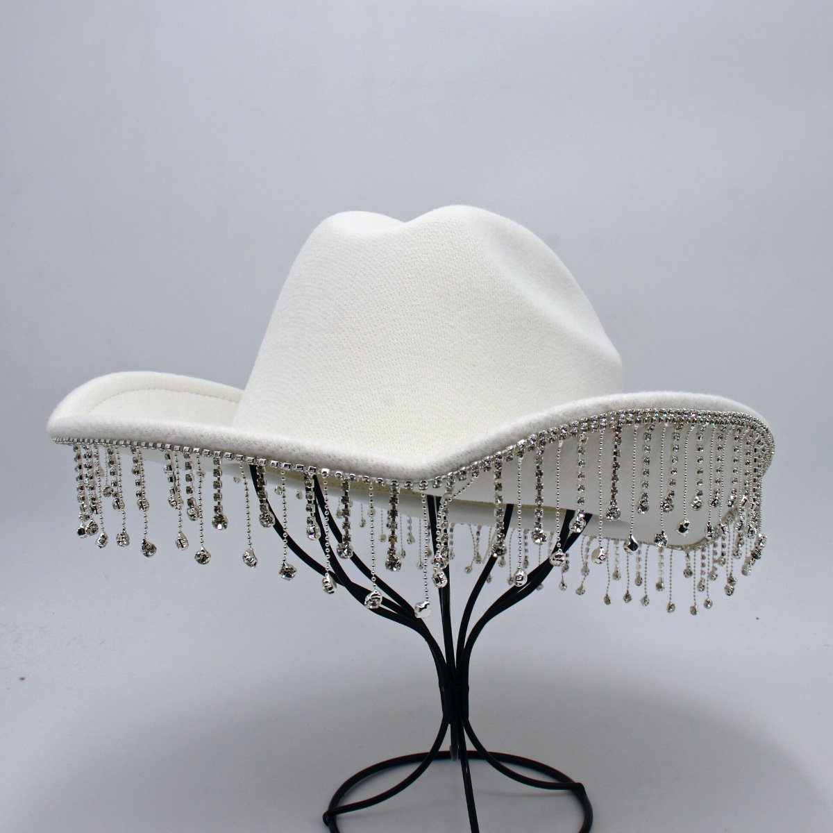 1e7e3027-eb38-43c3-bc6a-9eb7db2fa4bc.jpg Warped Top Hat With Diamond Tassel Western Cowboy Hat - Image 1