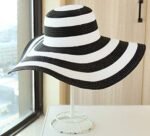 Women’s black and white striped strip hat with wide brim for beachwear